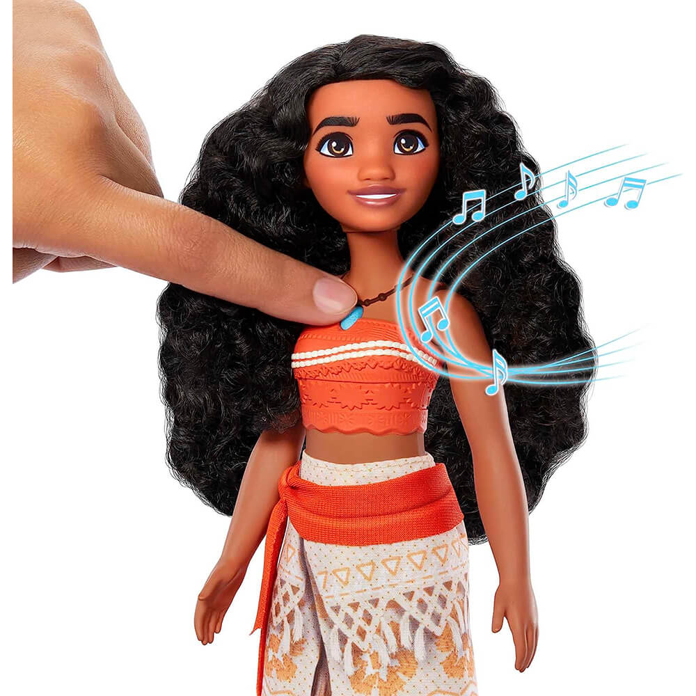 finger pressing Disney Princess Singing Moana Doll making her sing