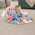 Baby crawling on the Fisher-Price Glow and Grow Kick & Play Piano Gym (Pink) with tummy time.