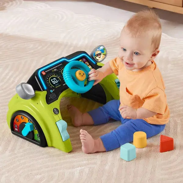 Fisher-Price Laugh & Learn Sit & Steer Driver Activity Center with child