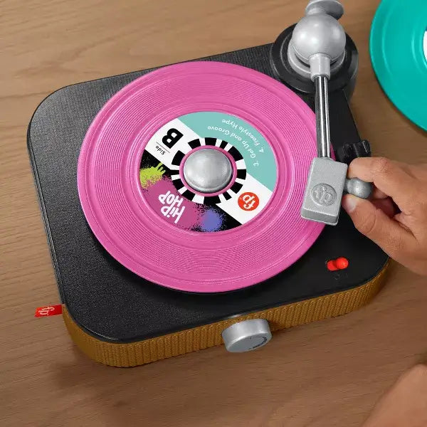 Fisher-Price Rockin’ Record Player hand playing record