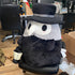 The Massive Squishable Plague Doctor sitting in a chair