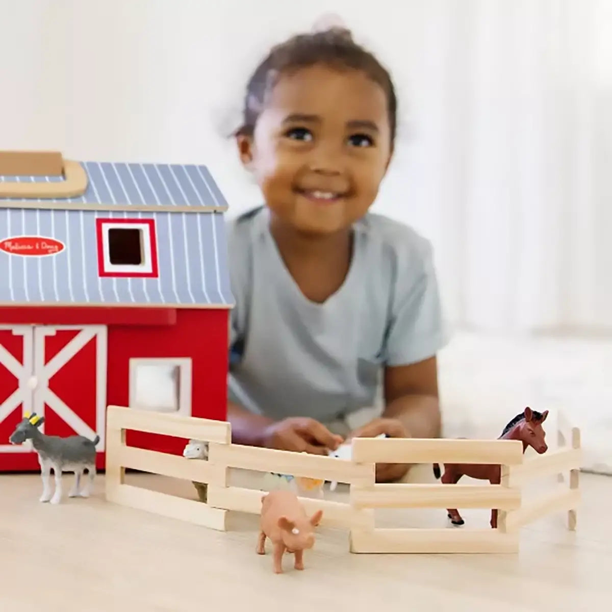 Melissa and Doug Fold & Go Barn fence set up