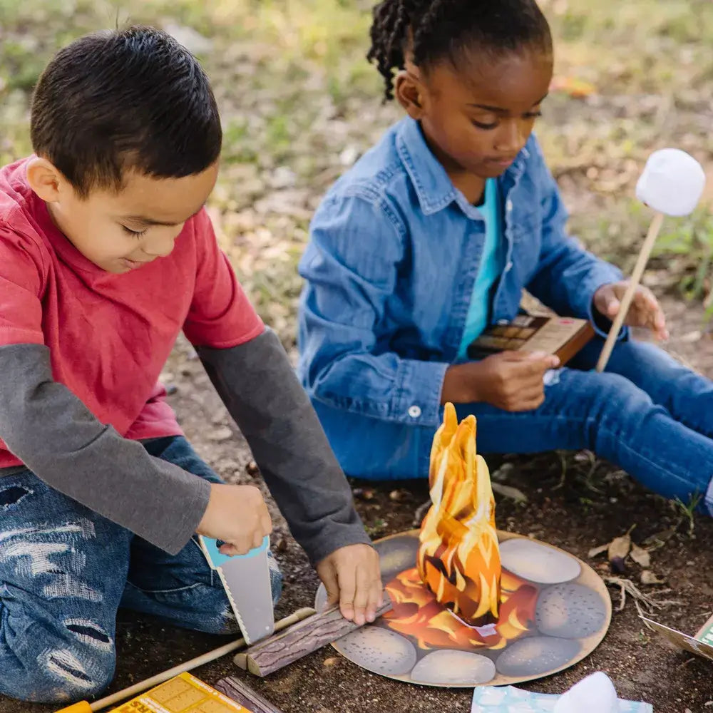 boy and girl playing the campfire playset