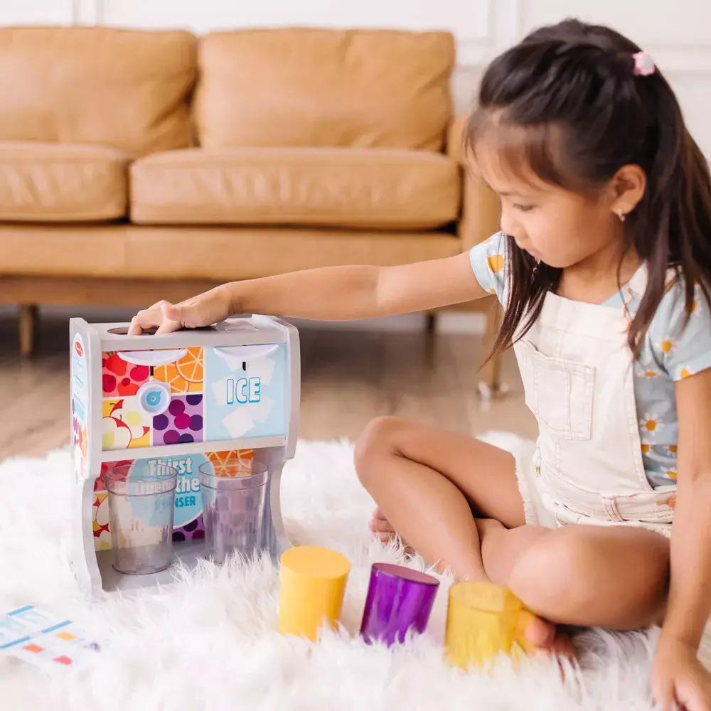 Girl wearing rompers playing the playset for melissa and doug 