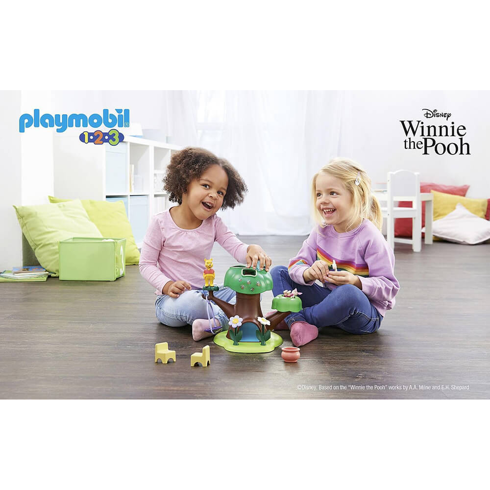 children playing with the PLAYMOBIL 1.2.3 & Disney: Winnie's & Piglet's Tree House