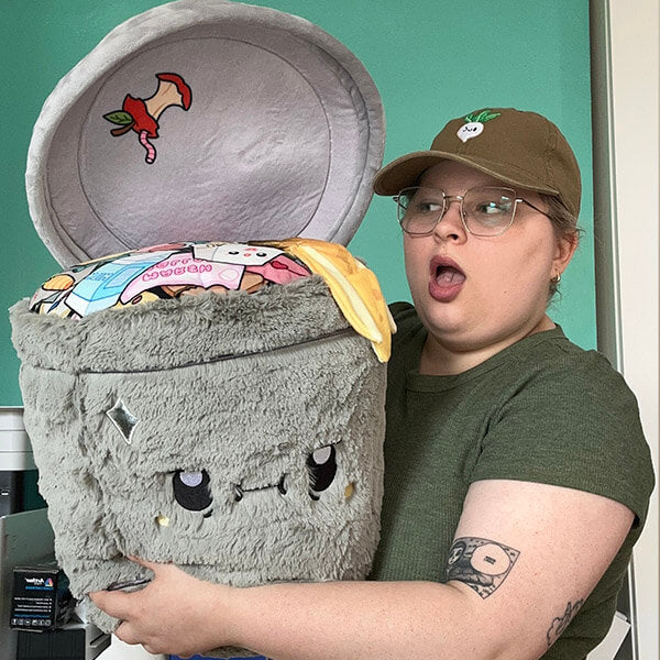 Woman holding the Squishable Trash Can Plush