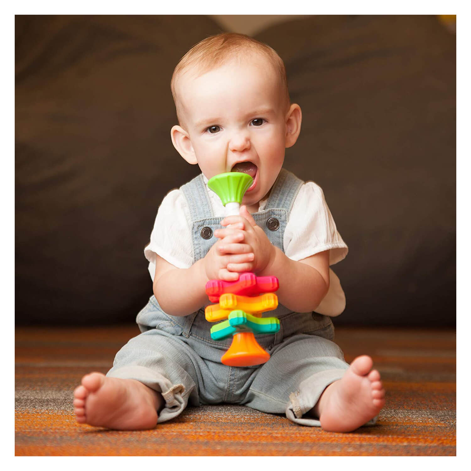 Baby chewing on the toy.