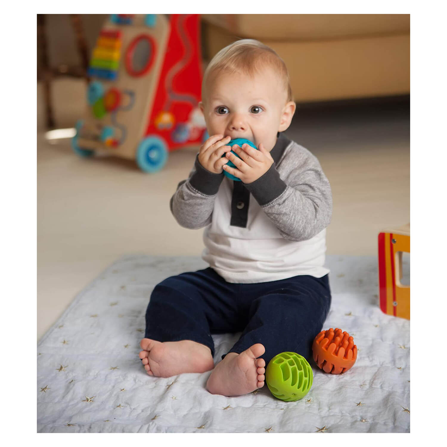 Baby chewing on the toy.