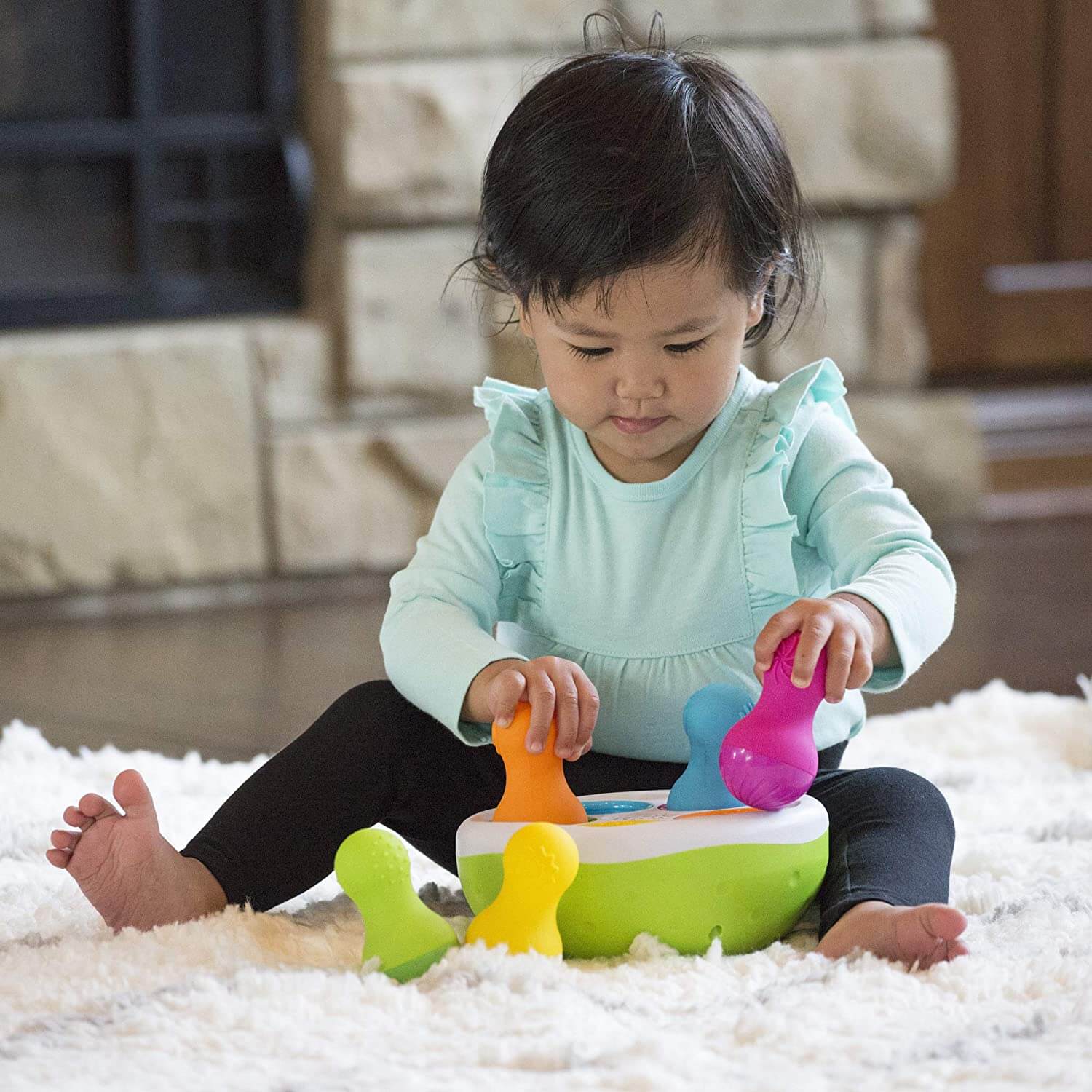 Baby playing with the toy.