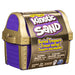 Front of Kinetic Sand Buried Treasure package which is purple and gold.