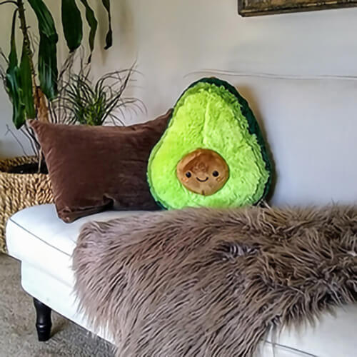 Squishable comfort food sits perfect displayed on this comfy couch.